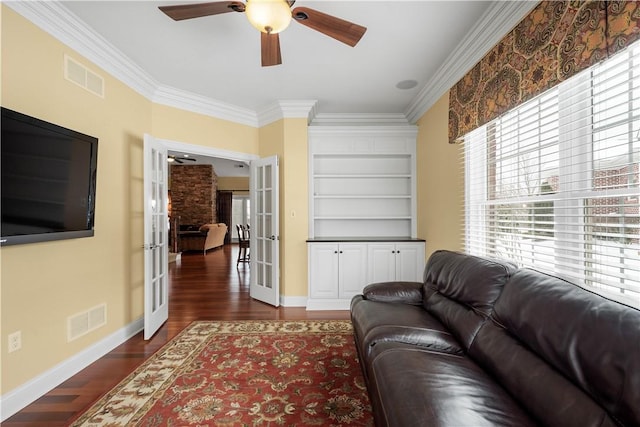 living room with french doors, dark wood finished floors, visible vents, and crown molding