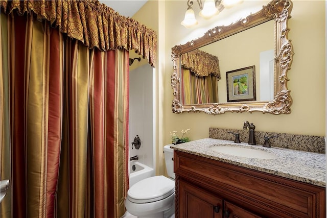 bathroom with shower / tub combo, vanity, and toilet