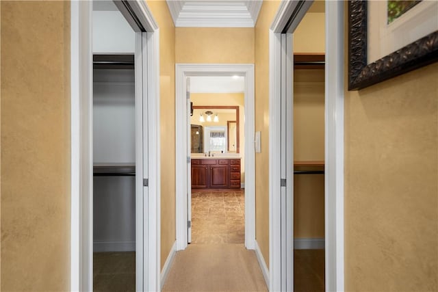 hallway featuring crown molding