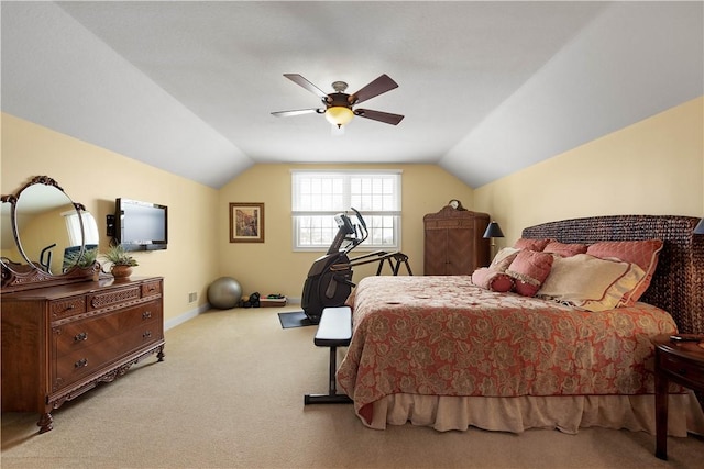 carpeted bedroom featuring lofted ceiling, a ceiling fan, and baseboards