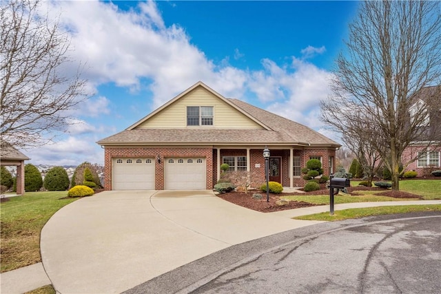 view of front of house featuring driveway, brick siding, and a front yard