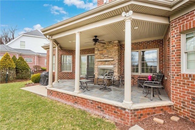 view of patio / terrace with grilling area and a ceiling fan