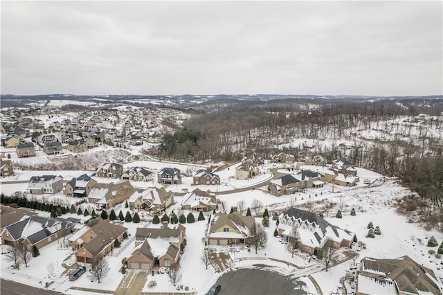 snowy aerial view featuring a residential view