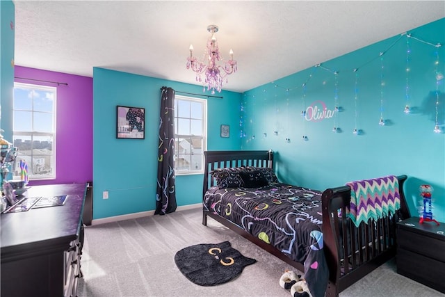 bedroom featuring carpet, multiple windows, baseboards, and an inviting chandelier