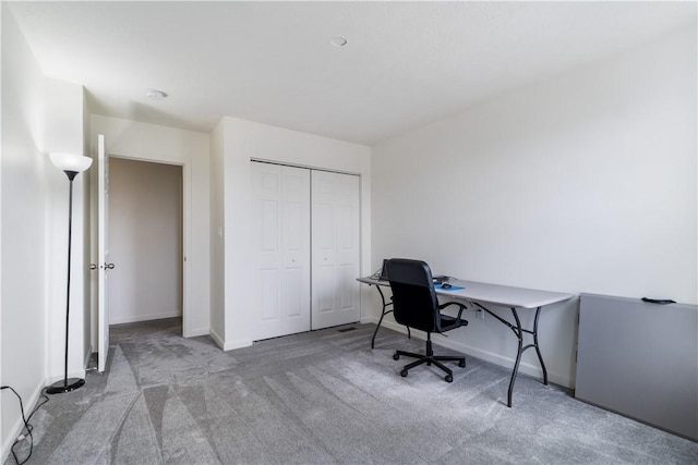 home office with carpet flooring and baseboards