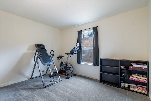 exercise area with carpet floors and baseboards