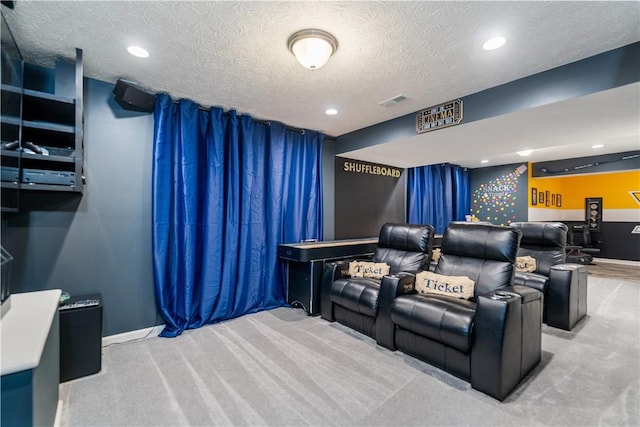 carpeted home theater with baseboards, visible vents, a textured ceiling, and recessed lighting