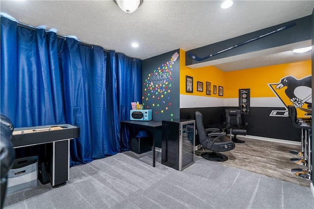 interior space featuring a textured ceiling and wood finished floors