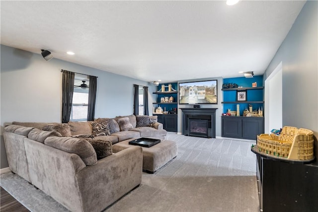 living room with a glass covered fireplace