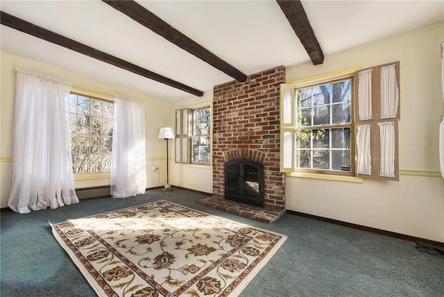 unfurnished living room featuring carpet, a fireplace, beam ceiling, and a wealth of natural light