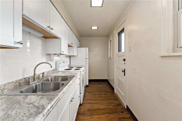 kitchen with white electric range, a sink, white cabinetry, and decorative backsplash