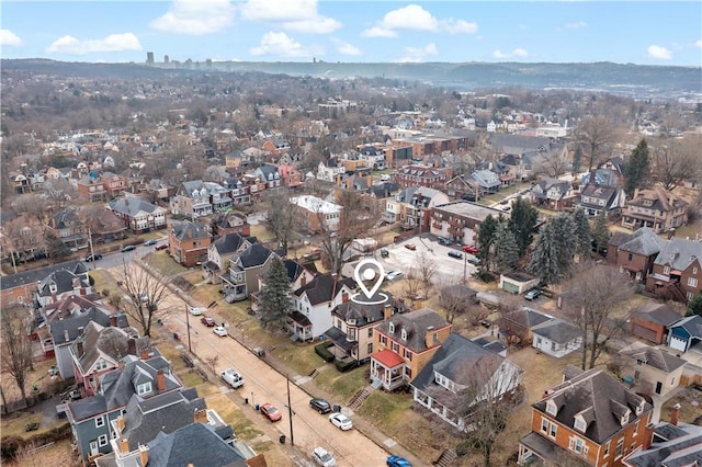 birds eye view of property with a residential view