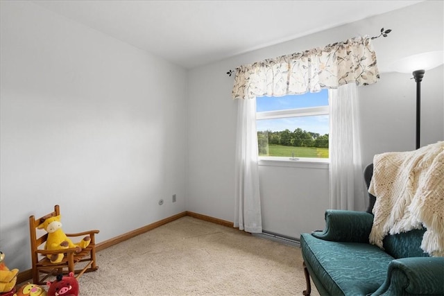 sitting room with light carpet and baseboards