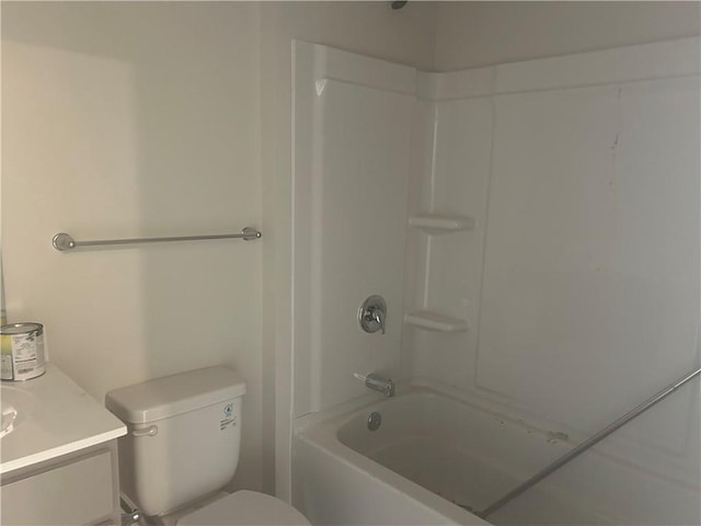 full bath with toilet,  shower combination, and vanity