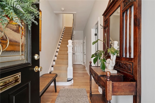 foyer with stairway and wood finished floors