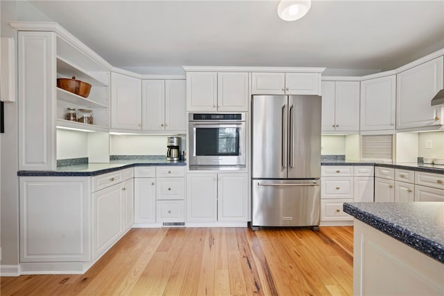 kitchen featuring open shelves, light wood-style floors, white cabinets, and stainless steel appliances