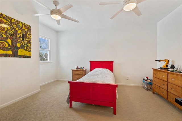 bedroom featuring carpet floors, a ceiling fan, and baseboards