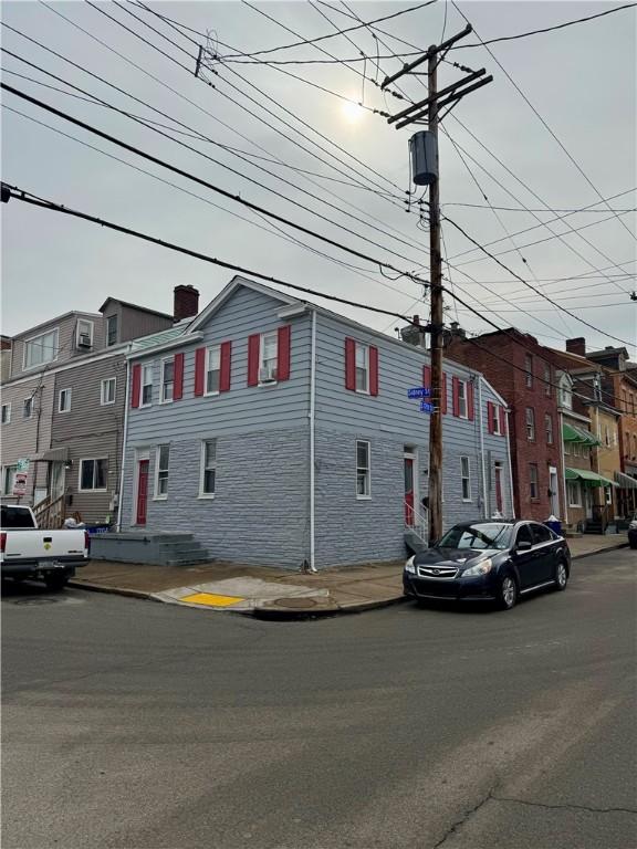 exterior space featuring a residential view and a chimney