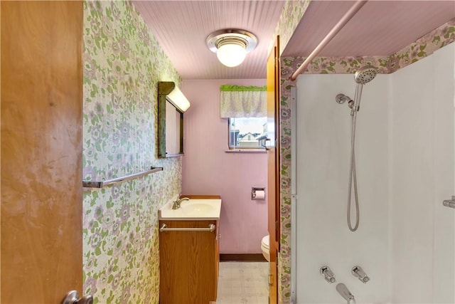 bathroom featuring baseboards, toilet, shower / tub combination, tile patterned floors, and vanity