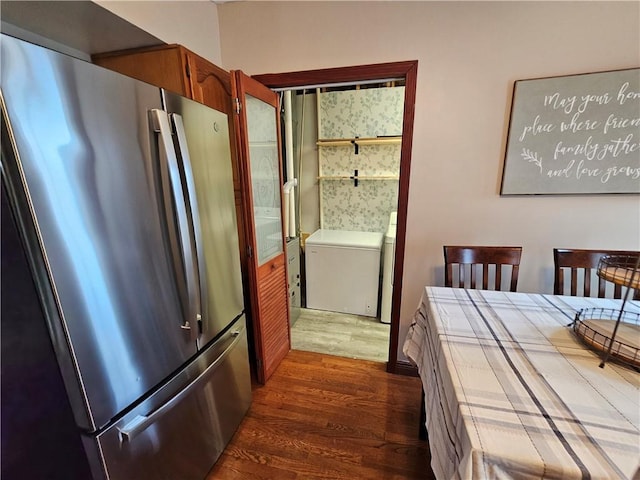 interior space with dark wood-style floors, freestanding refrigerator, and refrigerator