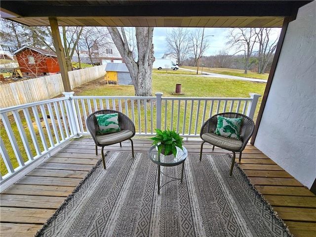 wooden deck with a yard