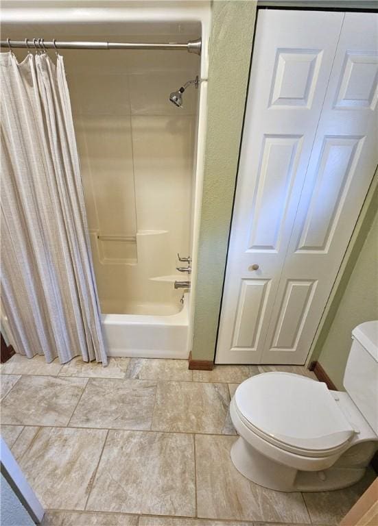 full bath with shower / tub combo and toilet