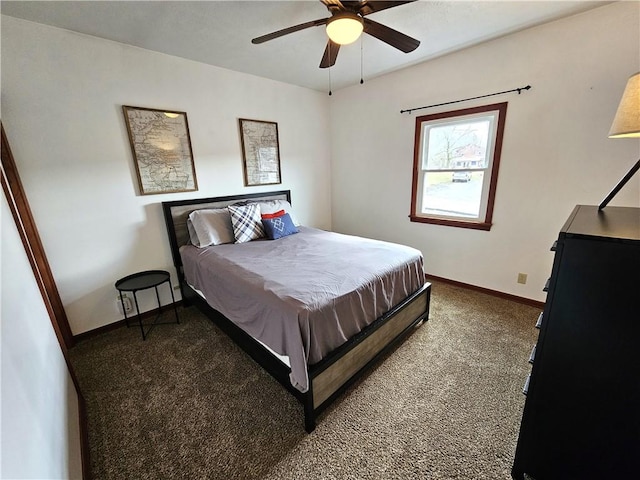 carpeted bedroom featuring baseboards and a ceiling fan