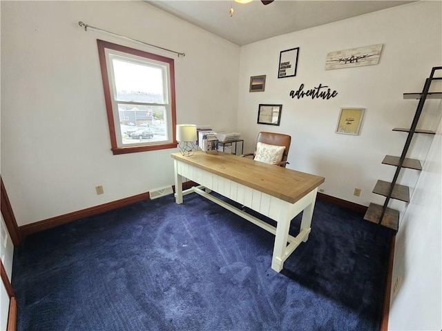 office space with carpet flooring, ceiling fan, and baseboards