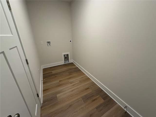 laundry room featuring dark wood-style floors, laundry area, washer hookup, and electric dryer hookup