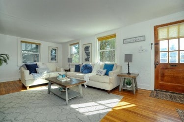 living area featuring wood finished floors and baseboards