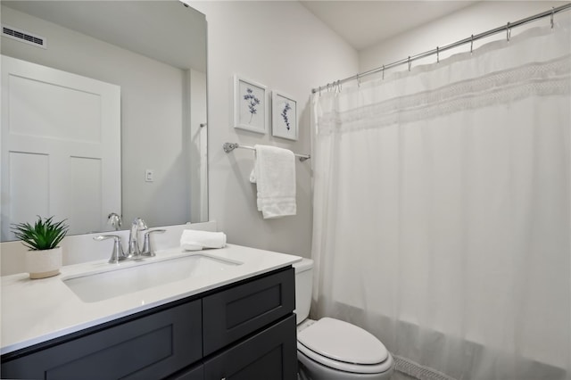 full bath with shower / tub combo, visible vents, vanity, and toilet