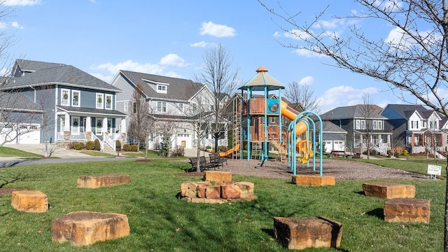 community playground with a residential view and a yard