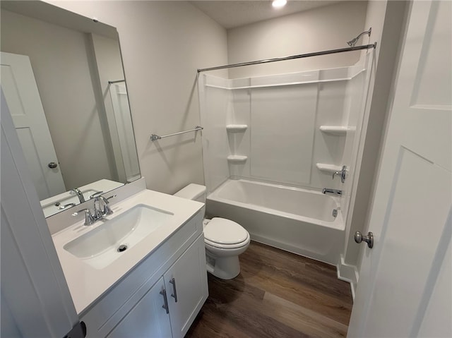 full bathroom with  shower combination, vanity, toilet, and wood finished floors