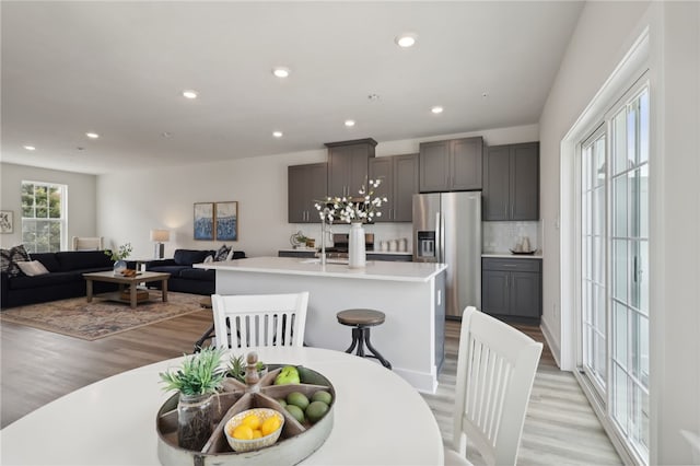 dining area featuring light wood-style floors and recessed lighting