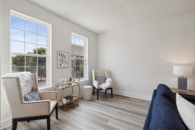 sitting room with wood finished floors and baseboards