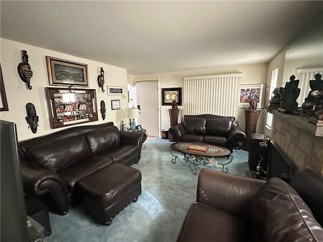 living room featuring carpet and a fireplace