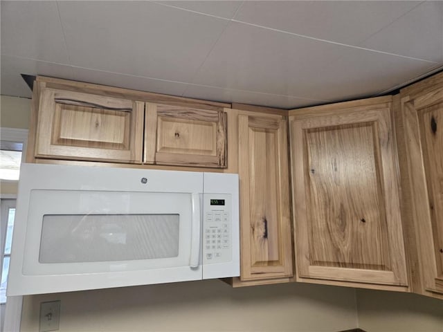 interior details featuring white microwave