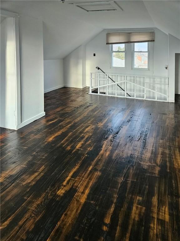 bonus room with lofted ceiling and hardwood / wood-style flooring