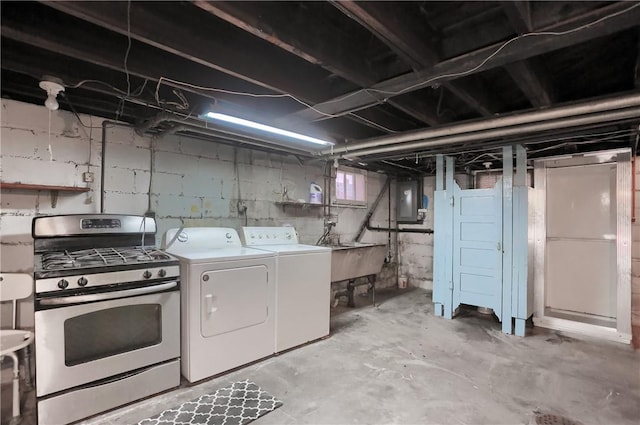 below grade area featuring separate washer and dryer, a sink, and electric panel