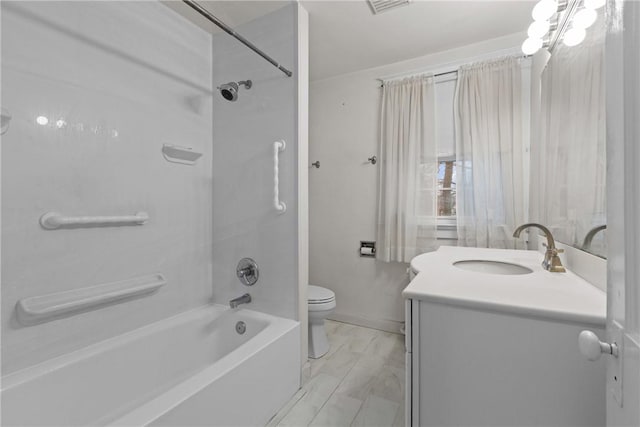 full bath with baseboards, shower / bath combination, vanity, and toilet