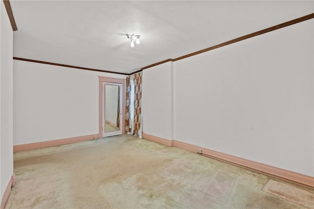 empty room with carpet floors and baseboards