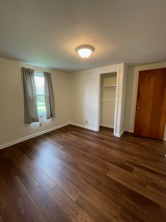 3503 State Route 208, Wilmington Twp, PA 16142 - unfurnished bedroom featuring dark wood finished floors and a closet