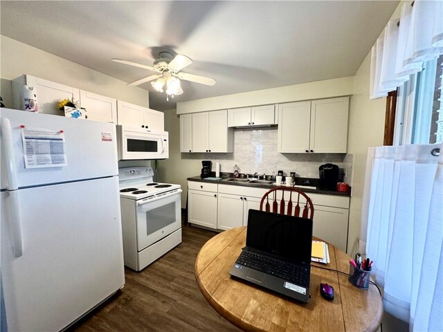3503 State Route 208, Wilmington Twp, PA 16142 - kitchen featuring white appliances, decorative backsplash, dark wood-type flooring, white cabinetry, and ceiling fan