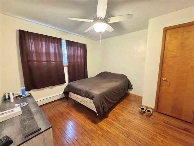 3503 State Route 208, Wilmington Twp, PA 16142 - bedroom featuring a baseboard heating unit, hardwood / wood-style floors, and a ceiling fan