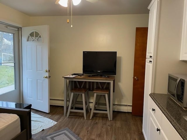 3503 State Route 208, Wilmington Twp, PA 16142 - dining area featuring a ceiling fan, dark wood finished floors, and a baseboard heating unit