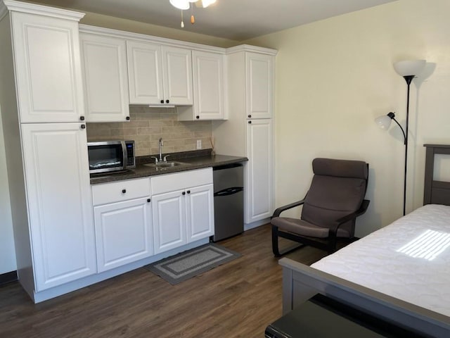 3503 State Route 208, Wilmington Twp, PA 16142 - kitchen featuring stainless steel microwave, fridge, tasteful backsplash, dark wood finished floors, and dark countertops