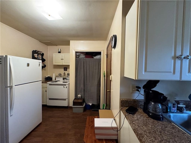 3503 State Route 208, Wilmington Twp, PA 16142 - kitchen featuring white appliances, dark wood-style flooring, white cabinets, and dark countertops