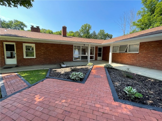 3503 State Route 208, Wilmington Twp, PA 16142 - rear view of property with brick siding, a chimney, and a patio area