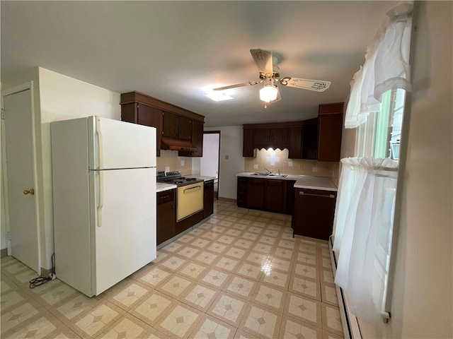 3503 State Route 208, Wilmington Twp, PA 16142 - kitchen featuring freestanding refrigerator, range with electric cooktop, a ceiling fan, light floors, and dark brown cabinetry