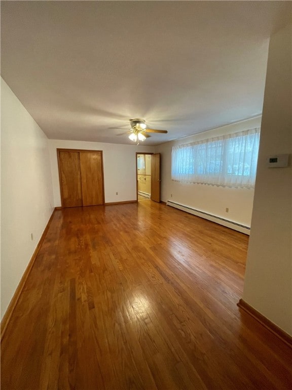 3503 State Route 208, Wilmington Twp, PA 16142 - spare room with a baseboard radiator, wood finished floors, ceiling fan, and baseboard heating